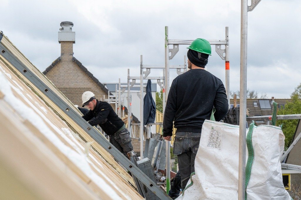 Roofers Installing Roof Battens on Scaffolding