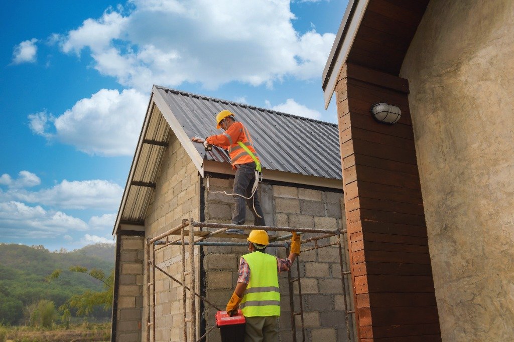 Roofing Contractors Working On Scaffolding